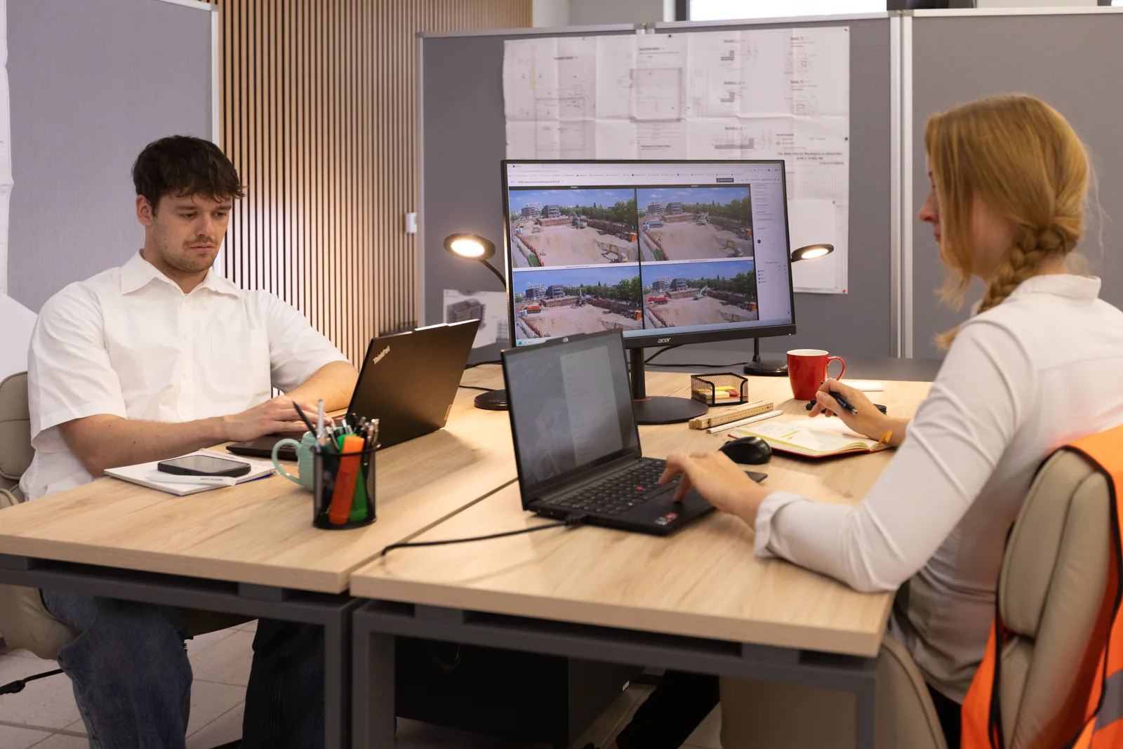 Team reviewing access control in the BauTV+ portal at the workplace